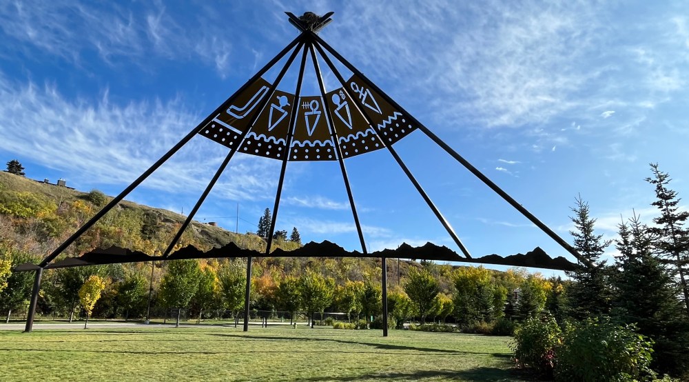 Tipi art installation in ENMAX Park along Elbow River pathway 
